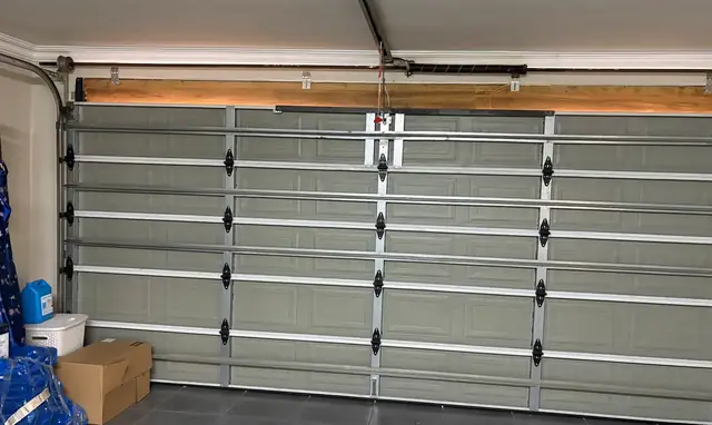 Inside of a steel sectional garage door with torsion spring